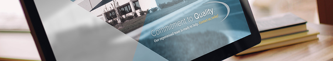 Text reading “Commitment to quality” and smaller text on Buckley Industries website, on a monitor.